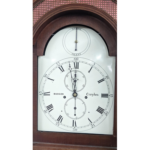 50 - An early 19th century mahogany 8 day longcase clock, having an arched top with pierced grille above ... 