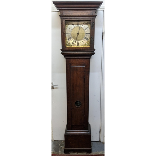 51 - An early 18th century oak cased 30 hour longcase clock, having a moulded and stepped cornice, the sq... 