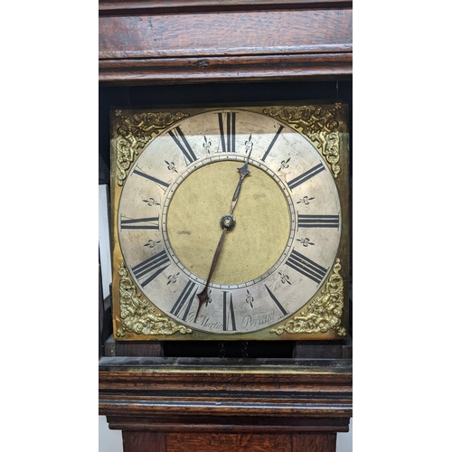 51 - An early 18th century oak cased 30 hour longcase clock, having a moulded and stepped cornice, the sq... 