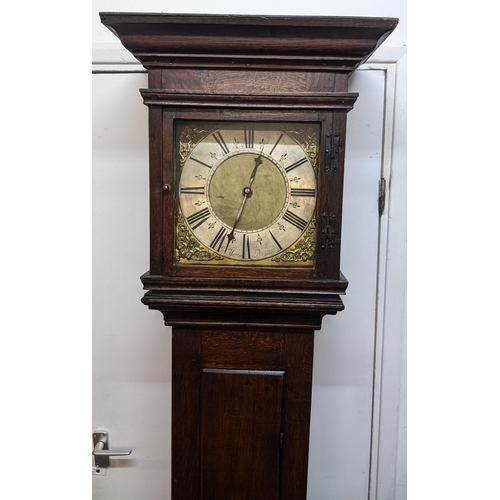 51 - An early 18th century oak cased 30 hour longcase clock, having a moulded and stepped cornice, the sq... 