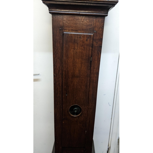 51 - An early 18th century oak cased 30 hour longcase clock, having a moulded and stepped cornice, the sq... 