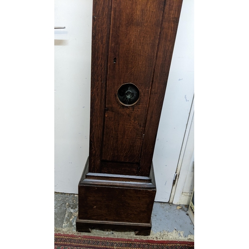 51 - An early 18th century oak cased 30 hour longcase clock, having a moulded and stepped cornice, the sq... 