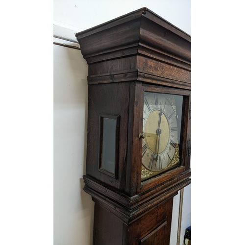 51 - An early 18th century oak cased 30 hour longcase clock, having a moulded and stepped cornice, the sq... 