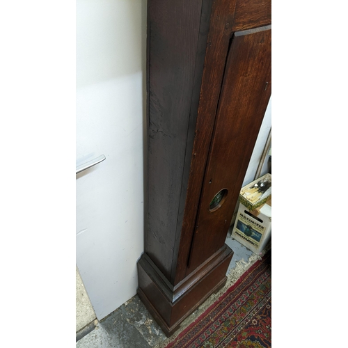 51 - An early 18th century oak cased 30 hour longcase clock, having a moulded and stepped cornice, the sq... 