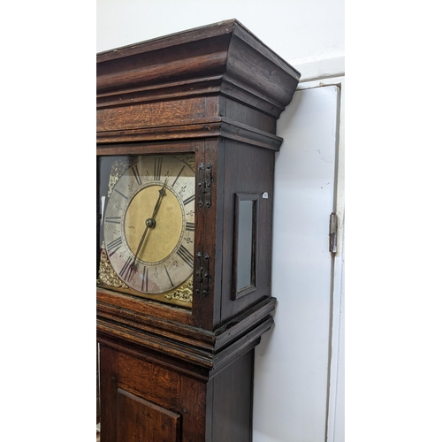 51 - An early 18th century oak cased 30 hour longcase clock, having a moulded and stepped cornice, the sq... 