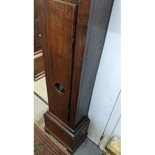 51 - An early 18th century oak cased 30 hour longcase clock, having a moulded and stepped cornice, the sq... 