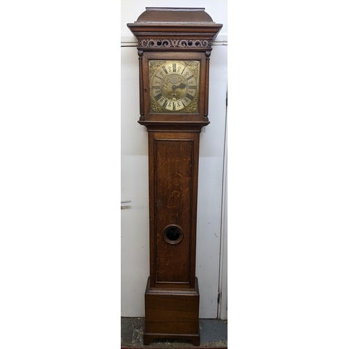 52 - A George II oak cased 30 hour longcase clock, having a moulded cornice, pierced fretwork above turne... 