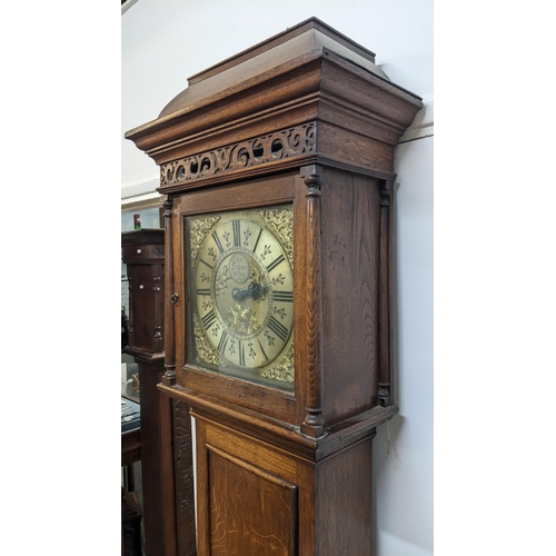 52 - A George II oak cased 30 hour longcase clock, having a moulded cornice, pierced fretwork above turne... 