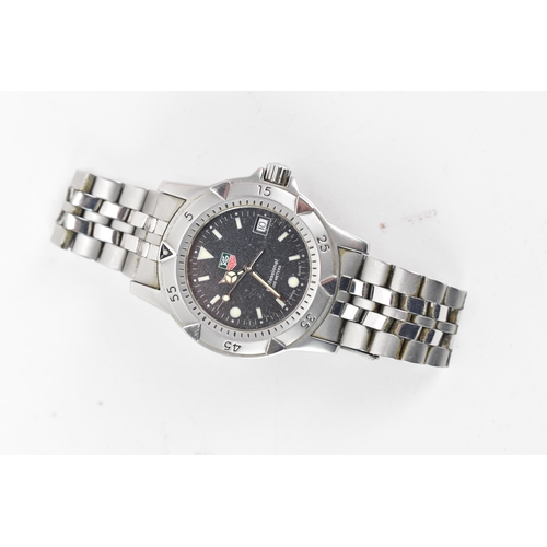 54 - A Tag Heuer Professional 2000, quartz, gents, stainless steel wristwatch, having a black dial with l... 