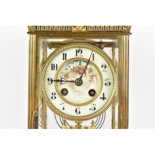 58 - A late 19th century French gilt metal and beveled glass mantle clock, the dial having a floral paint... 