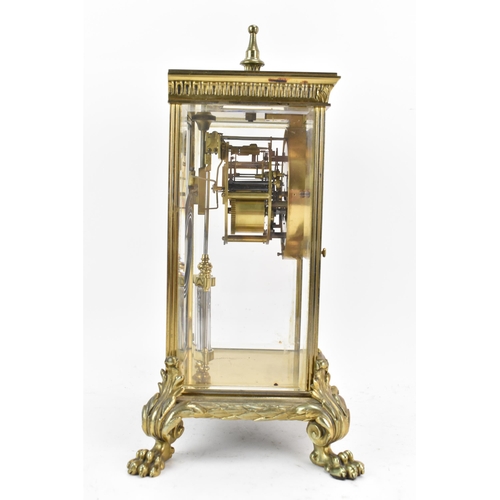 58 - A late 19th century French gilt metal and beveled glass mantle clock, the dial having a floral paint... 