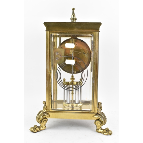 58 - A late 19th century French gilt metal and beveled glass mantle clock, the dial having a floral paint... 