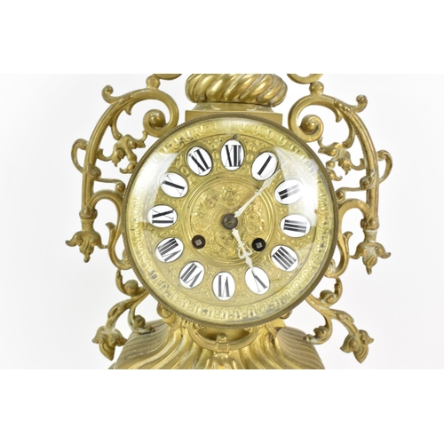 59 - A 19th century French brass mantle clock, the ornate case having pierced floral scroll work frame, t... 