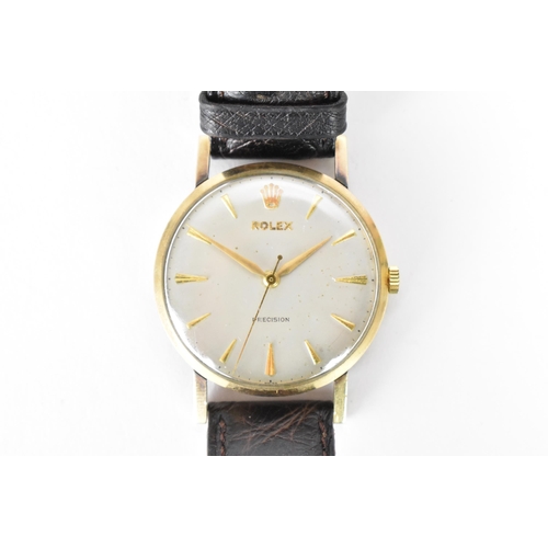 6 - A Rolex Precision, manual wind, gents, 9ct gold wristwatch circa 1956, having a silvered dial with c... 