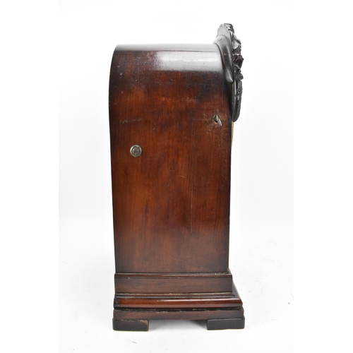 60 - A Victorian mahogany 8 day bracket clock, the arched top case having floral moulding, the 7