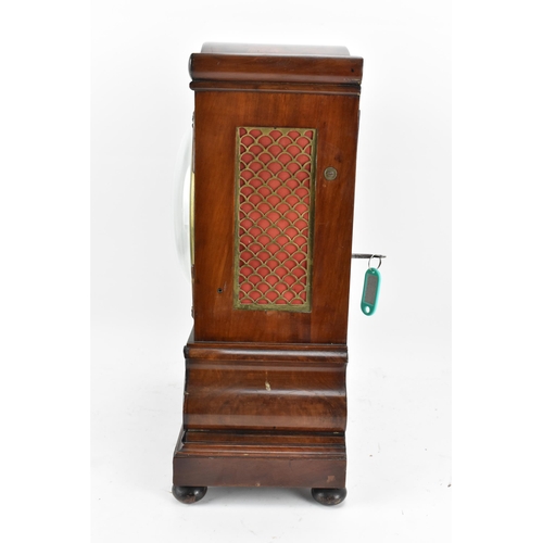 61 - A Victorian mahogany 8 day bracket clock, the case having an arched top, flower head and reeded moul... 