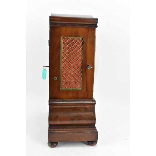 61 - A Victorian mahogany 8 day bracket clock, the case having an arched top, flower head and reeded moul... 