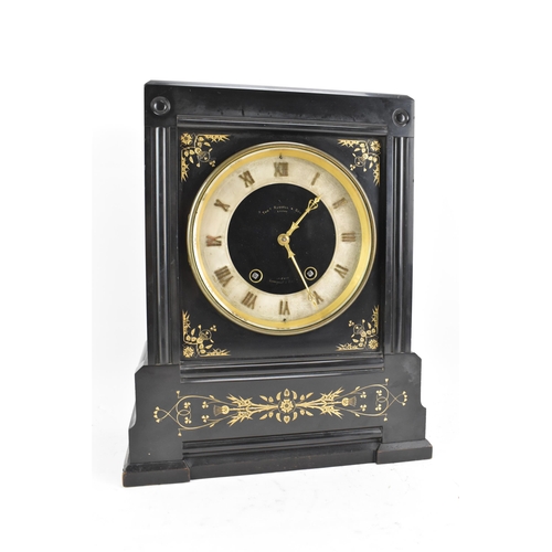 64 - A Victorian black slate 8 day mantle clock, the dial having a silvered chapter ring with gilt hands,... 