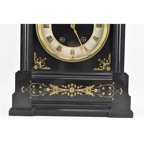 64 - A Victorian black slate 8 day mantle clock, the dial having a silvered chapter ring with gilt hands,... 