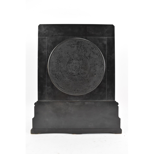 64 - A Victorian black slate 8 day mantle clock, the dial having a silvered chapter ring with gilt hands,... 