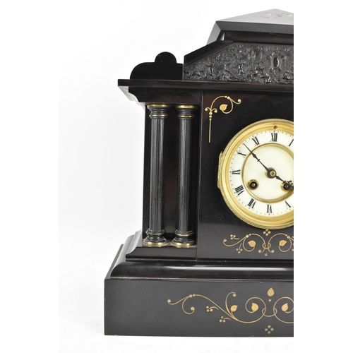 65 - A late 19th century French 8 day mantle clock, the case of architectural form with a scene of cherub... 