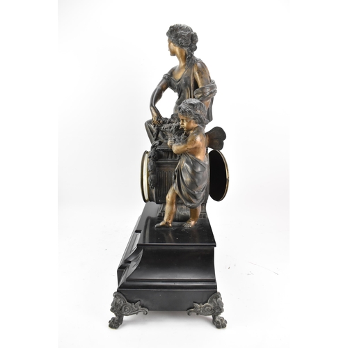 66 - A 19th century black slate 8 day mantle clock, the case surmounted by a spelter cherub and classical... 