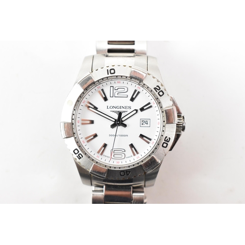 67 - A Longines Hydroconquest, quartz, gents, stainless steel wristwatch, having a white dial with lumino... 