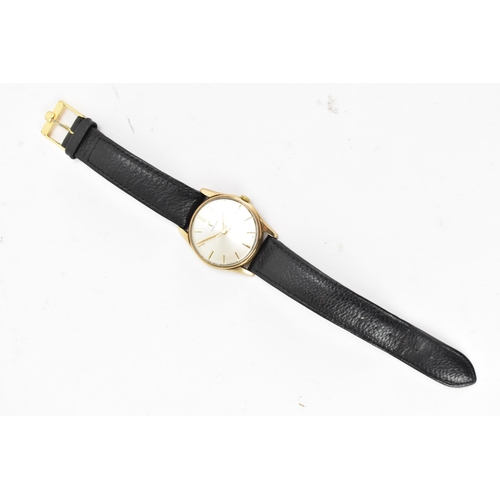 71 - An Omega, manual wind, gents, 9ct gold wristwatch, circa 1959, having a silvered dial with centre se... 