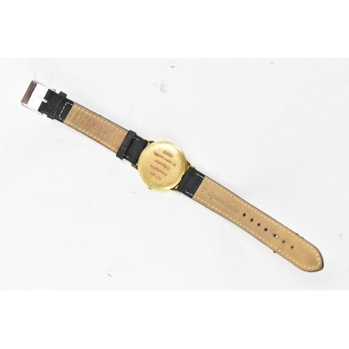 72 - A Garrard, quartz, gents, 18ct gold wristwatch, circa 1989, having a gilt dial with baton markers an... 