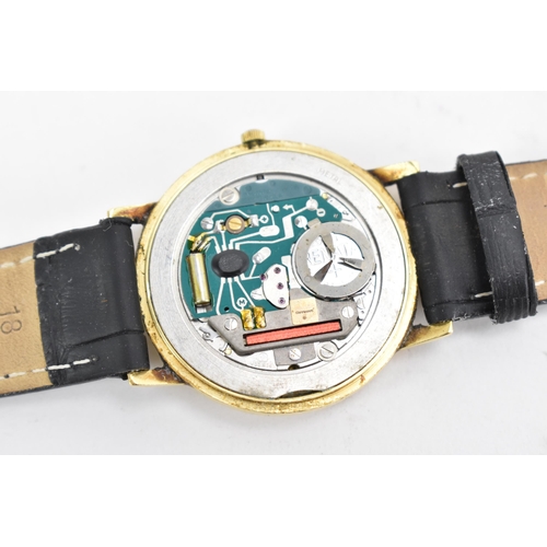 72 - A Garrard, quartz, gents, 18ct gold wristwatch, circa 1989, having a gilt dial with baton markers an... 