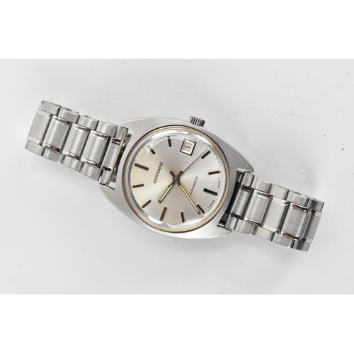 73 - A Garrard, automatic, gents, stainless steel wristwatch, circa 1974, having a silvered dial with bat... 