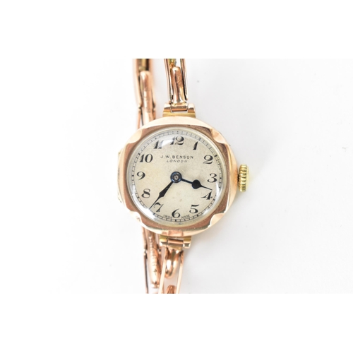 8 - A J.W Benson, manual wind, ladies, 9ct gold wristwatch, circa 1930s, having a silvered dial with Ara... 