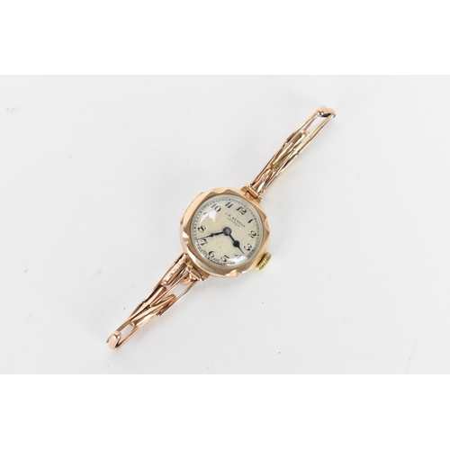 8 - A J.W Benson, manual wind, ladies, 9ct gold wristwatch, circa 1930s, having a silvered dial with Ara... 