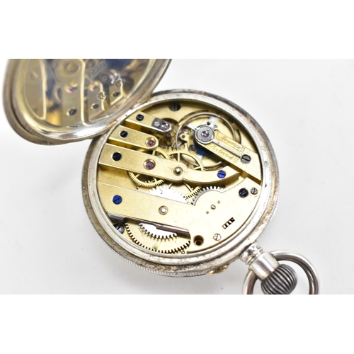 81 - An early 20th century silver open faced keyless wound pocket watch together with a silver fronted tr... 