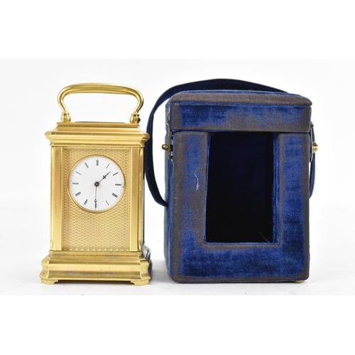 83 - A late 19th century French gilt metal miniature carriage clock, having machine turned decoration and... 