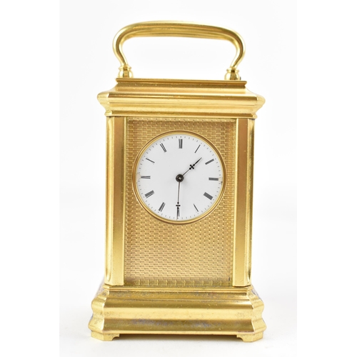 83 - A late 19th century French gilt metal miniature carriage clock, having machine turned decoration and... 