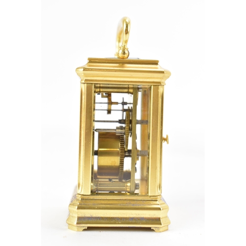 83 - A late 19th century French gilt metal miniature carriage clock, having machine turned decoration and... 