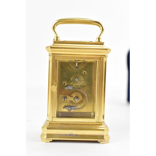 83 - A late 19th century French gilt metal miniature carriage clock, having machine turned decoration and... 