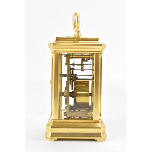 83 - A late 19th century French gilt metal miniature carriage clock, having machine turned decoration and... 