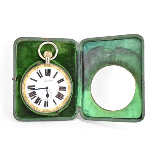 86 - An early 20th century oversized Goliath, open faced, travel pocket watch with case, the white enamel... 