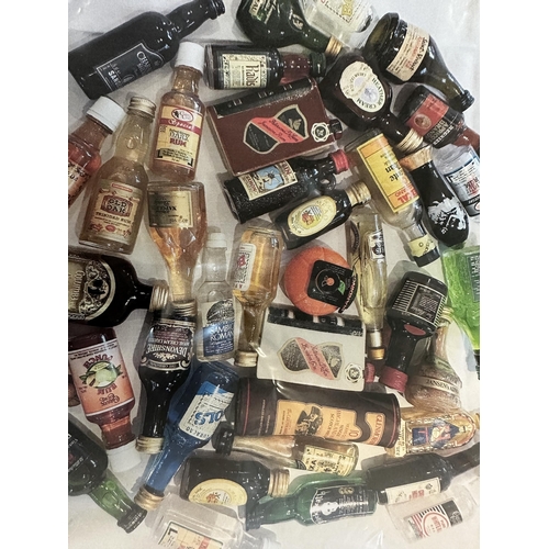 101 - A very large collection of over 290 miniatures, to include Scotch Whisky, Vodka, ceramic novelty min... 