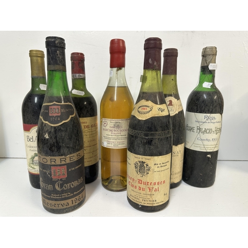 107 - Mixed bottles to include Rioja 1993, Cote's de Bourge 1982, Torres Gran Coronas Reserva 1964, 
Locat... 