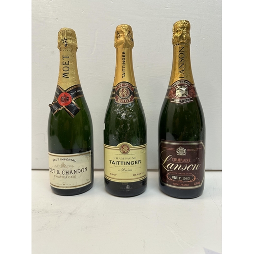 144 - Three bottles of Champagne to include Lanson, Taittinger and Moet Chandon,  Location: Crate
If there... 