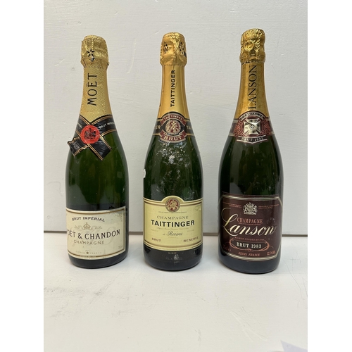 144 - Three bottles of Champagne to include Lanson, Taittinger and Moet Chandon,  Location: Crate
If there... 