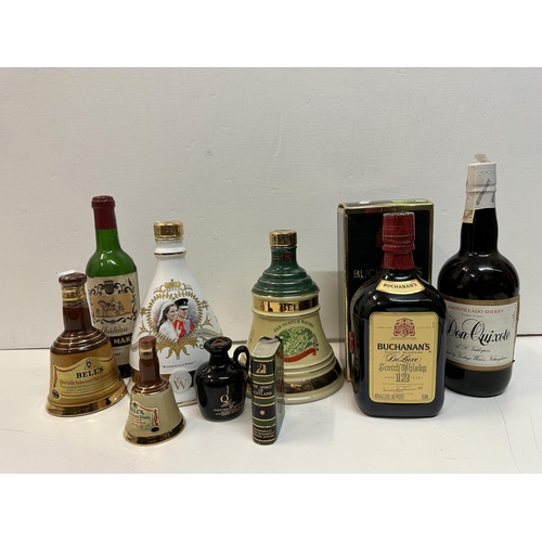 159 - A single bottle of Bucanan's de Luxe Scotch Whisky, 12 year old and two Bells ceramic flasks and mix... 