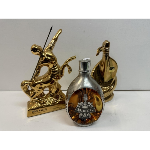 161 - A Limoges flask Larsen Cognac and Remy Martin flask, along with one bottle of Dimple Haig,  Location... 