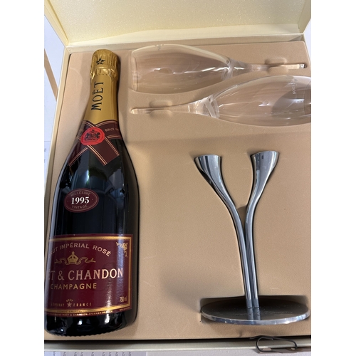 28 - A boxed bottle of Moet & Chandon 1995 Vintage, together with two glasses, stand and presentation cas... 