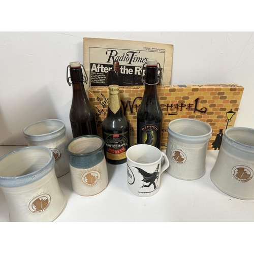 44 - A collection of Jack the Ripper memorabilia to include three bottles of beer, five stoneware tankard... 