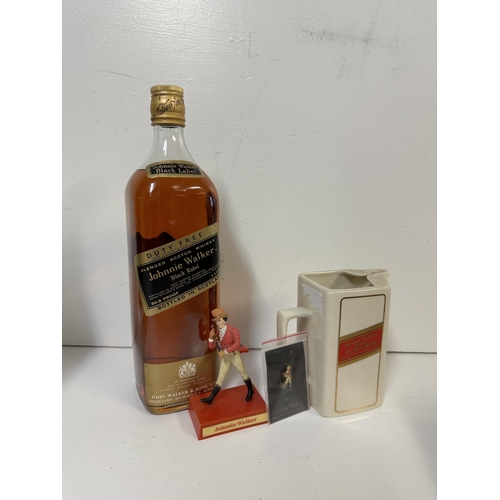 49 - A single bottle of Jonnie Walker Black Label Scotch Whisky, a Jonnie Walker water jug, stick pin and... 