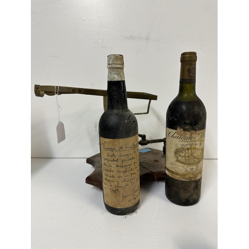 53 - A brass framed Port purer and two bottles of wine to include Chateau Kirwan Margaux, A/F  Location:
... 